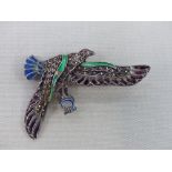 A VINTAGE PLIQUE A JOUR ENAMEL AND MARCASITE SET BIRD IN FLIGHT BROOCH.