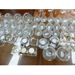A QUANTITY OF GLASS BUD VASES AND TEA LIGHT STANDS.