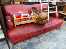 A LEATHER UPHOLSTERED HOWARD STYLE TWO SEAT SETTEE.