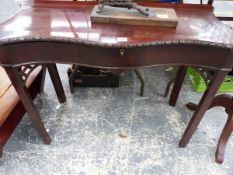 A GEORGIAN MAHOGANY SERPENTINE SIDE TABLE.