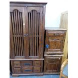 AN EASTERN HARDWOOD WARDROBE AND TWO BEDSIDE CABINETS.