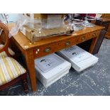 A LARGE OAK WRITING TABLE.