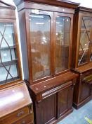 A VICTORIAN MAHOGANY GLAZED BOOK CASE ON CABINET.