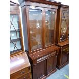 A VICTORIAN MAHOGANY GLAZED BOOK CASE ON CABINET.