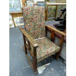 A MORRIS STYLE RECLINING ROCKING CHAIR.