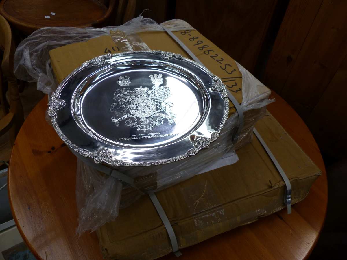 A QUANTITY OF SILVER PLATED ARMORIAL PLATTERS.