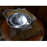 A QUANTITY OF SILVER PLATED ARMORIAL PLATTERS.