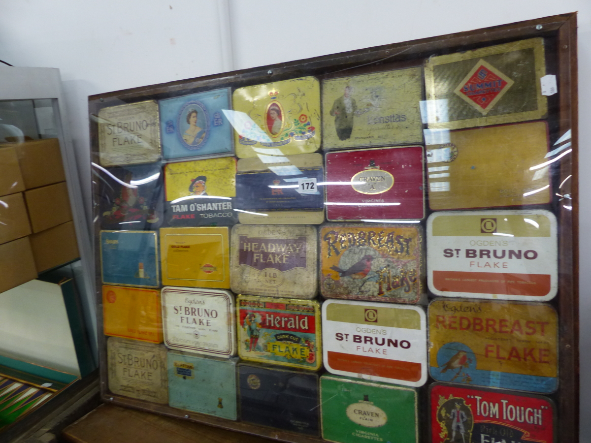 A FRAMED COLLECTION OF CIGARETTE AND TOBACCO TINS.