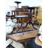 A VICTORIAN OAK CENTRE TABLE AND THREE MAHOGANY TRIPOD TABLES.