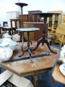 A VICTORIAN OAK CENTRE TABLE AND THREE MAHOGANY TRIPOD TABLES.