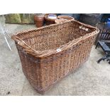 A VINTAGE LOG BASKET.