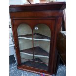 A 19th C. MAHOGANY CORNER CABINET.