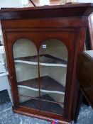 A 19th C. MAHOGANY CORNER CABINET.