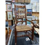 ANTIQUE RUSH SEAT ROCKING CHAIR.