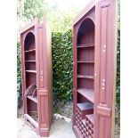 A PAIR OF LARGE BESPOKE MAHOGANY CORNER DRINKS CABINETS WITH PANELLED DOORS.