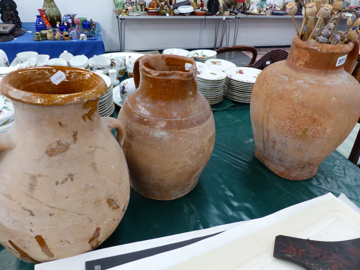 THREE RUSTIC TERRACOTTA JUGS.