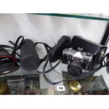 A VINTAGE PRINZFLEX CAMERA, A SOLIGOR LENS, A PAIR OF SOLUS BINOCULARS, AND CASES.