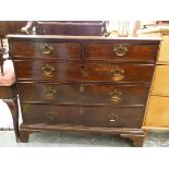 A GEORGIAN OAK CHEST OF DRAWERS.