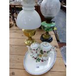 A VICTORIAN OIL LAMP, A LATER PARAFFIN LAMP, AND A COPENHAGEN PART TEA SERVICE ON TRAY.
