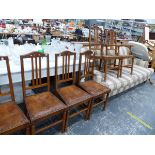 A SET OF SIX ARTS AND CRAFTS OAK DINING CHAIRS.