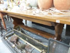 AN OAK REFECTORY DINING TABLE.