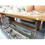 AN OAK REFECTORY DINING TABLE.