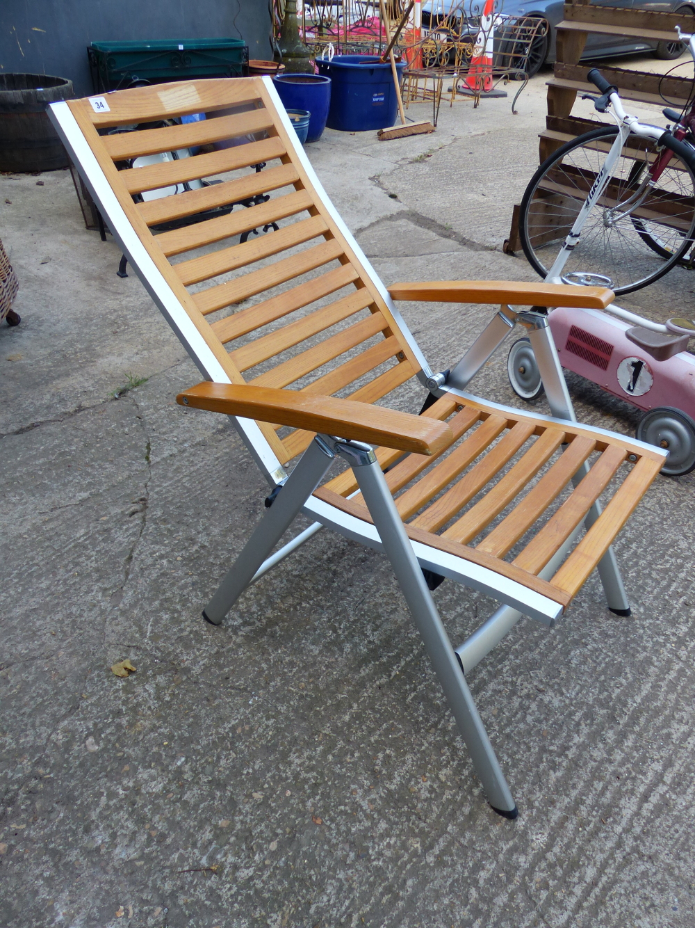 A FOLDING PATIO CHAIR.