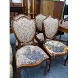 A SET OF FOUR FRENCH STYLE SHIELD BACK SIDE CHAIRS.