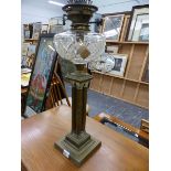 A VICTORIAN FOUR COLUMN OIL LAMP.