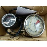 A VOLVO DASH MOUNTED REV COUNTER AND AN S SMITH AND SONS REV COUNTER.