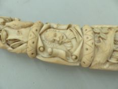 A 19th CENTURY CARVED IVORY HORN DEPICTING EUROPEAN HUNT SCENES AND INSCRIBED WITH PORTRAITS