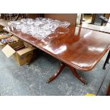 A GEORGIAN MAHOGANY TWIN PEDESTAL DINING TABLE WITH CENTRAL LEAF.