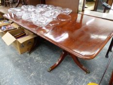 A GEORGIAN MAHOGANY TWIN PEDESTAL DINING TABLE WITH CENTRAL LEAF.