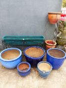 A GROUP OF BLUE GLAZED GARDEN PLANTERS, A WROUGHT IRON STAND AND A TWO TIER STAND.