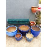 A GROUP OF BLUE GLAZED GARDEN PLANTERS, A WROUGHT IRON STAND AND A TWO TIER STAND.