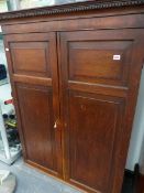 AN 18th C. OAK PANEL DOOR CABINET.