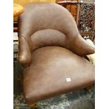 A LEATHER UPHOLSTERD LOW TUB CHAIR.