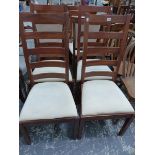 A SET OF MODERN LADDER BACK SIDE CHAIRS.