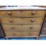 A VICTORIAN MAHOGANY FOUR DRAWER CHEST.