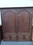 AN 18th C. AND LATER OAK TWO DOOR LARGE HALL CABINET.