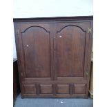 AN 18th C. AND LATER OAK TWO DOOR LARGE HALL CABINET.