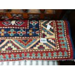 A SMALL PERSIAN HAND WOVEN RUG.