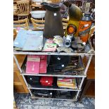 A VINTAGE STEEL FOUR TIER WORK TABLE, MOTORCAR RELATED TOOLS, AA BADGES, OIL CANS ETC.