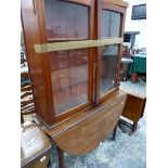 A GEORGIAN MAHOGANY DROP LEAF TABLE AND A BOOKCASE.