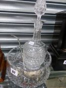 A CUT GLASS DECANTER, A CUT GLASS BOWL, AND A SILVER PLATED LADLE.
