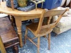 A CIRCULAR PINE KITCHEN TABLE AND THREE OXFORD CHAIRS.