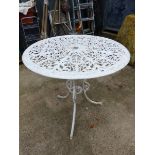 A VINTAGE CAST IRON GARDEN TABLE.