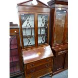 AN EDWARDIAN MAHOGANY AND INLAID BUREAU BOOKCASE.