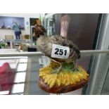 A PAIR OF ANTIQUE PORCELAIN BIRD FIGURES.