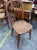 A SET OF FOUR SPINDLE BACK KITCHEN CHAIRS.